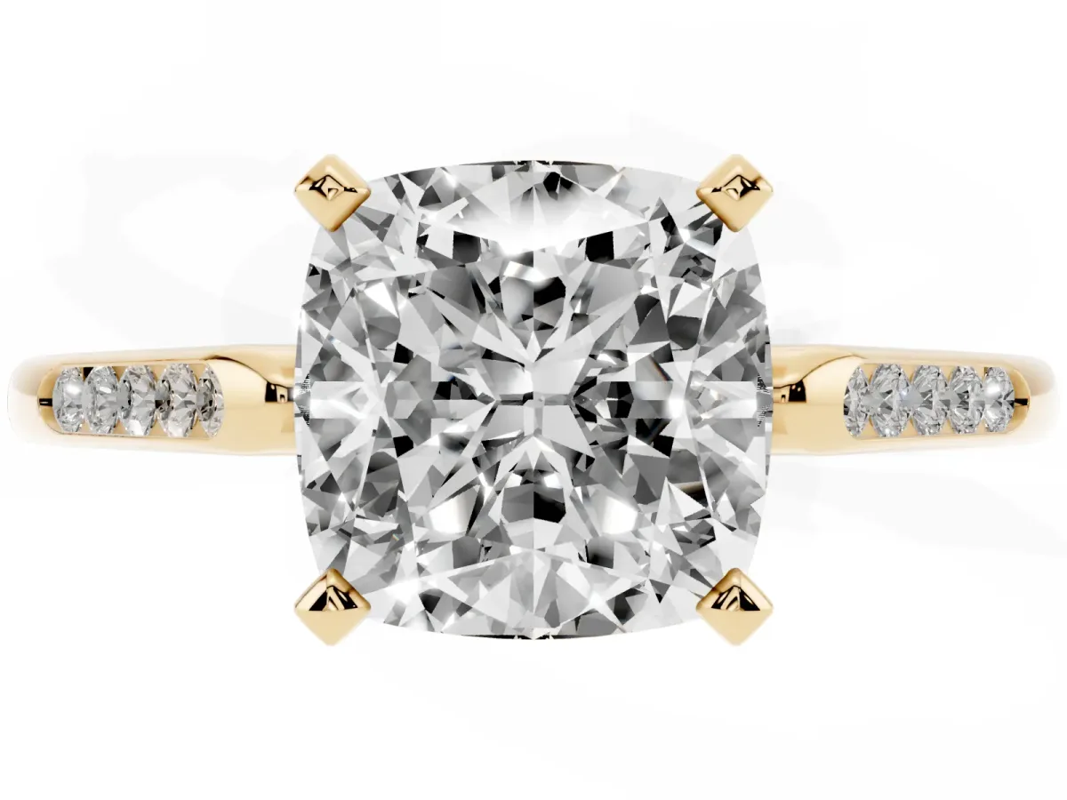 Cushion Cut Diamond Solitaire Ring with Channel Set Round Band and Prong Setting Yellow gold
