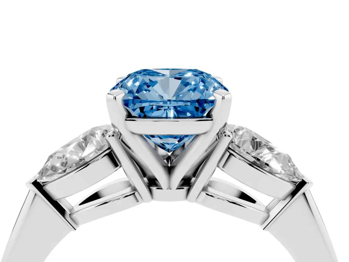 Fancy Blue Three-Stone Cushion Cut Diamond Ring with Pear Side Stones and Four-Prong Setting Platinum