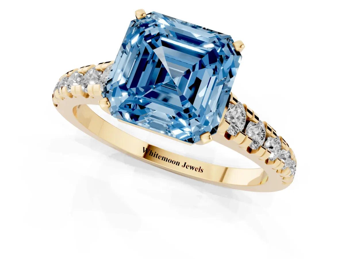 Fancy Blue Asscher Cut Diamond Cathedral Solitaire Ring with Round Pavé Band Yellow gold
