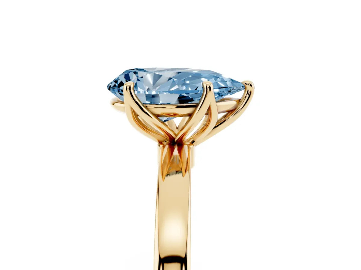 Fancy Blue Pear Cut Diamond Solitaire Ring with Thin Band and Prong Setting Yellow gold