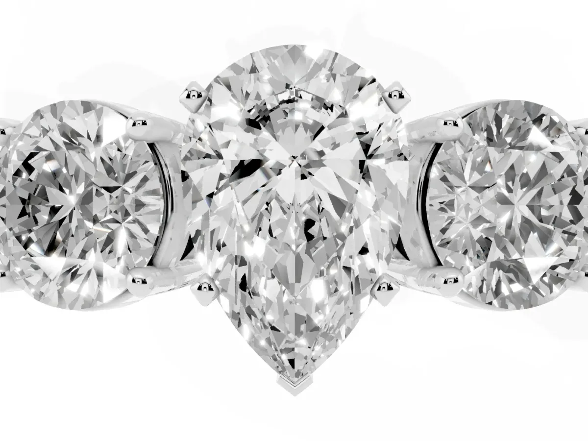 Three-Stone Pear Cut Diamond Ring with Round Side Stones, Classic Band, and Four-Prong Setting Platinum
