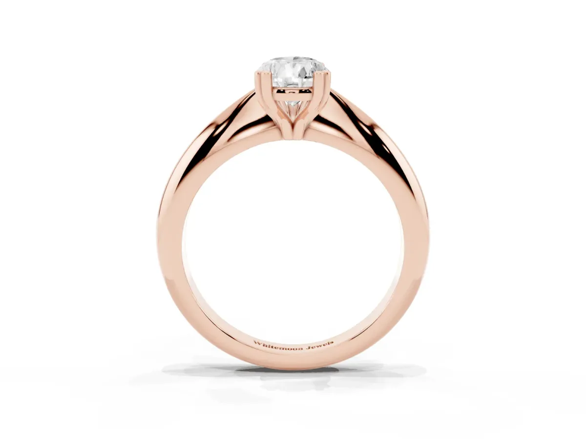 Pear Cut Cut Solitaire Engagement Ring with Tapered Band and Four-Prong Setting Rose gold