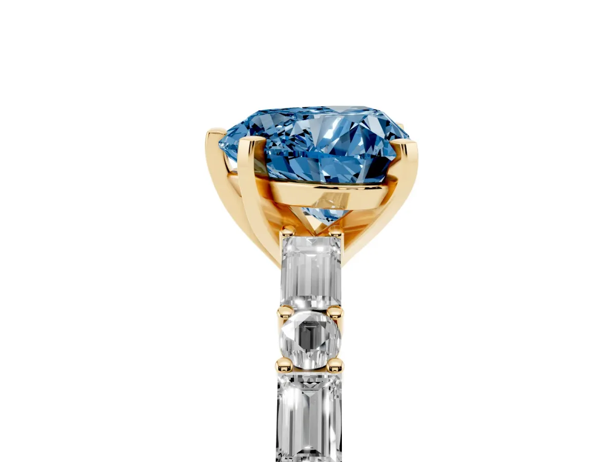 Fancy Blue Heart Cut Diamond Solitaire with Side Baguettes and Channel Set Band Yellow gold