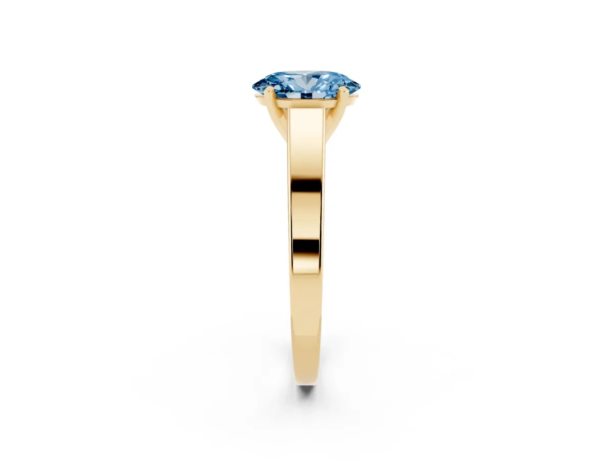 Fancy Blue Oval Cut Solitaire Engagement Ring with Four-Prong Setting and Tapered Band Yellow gold