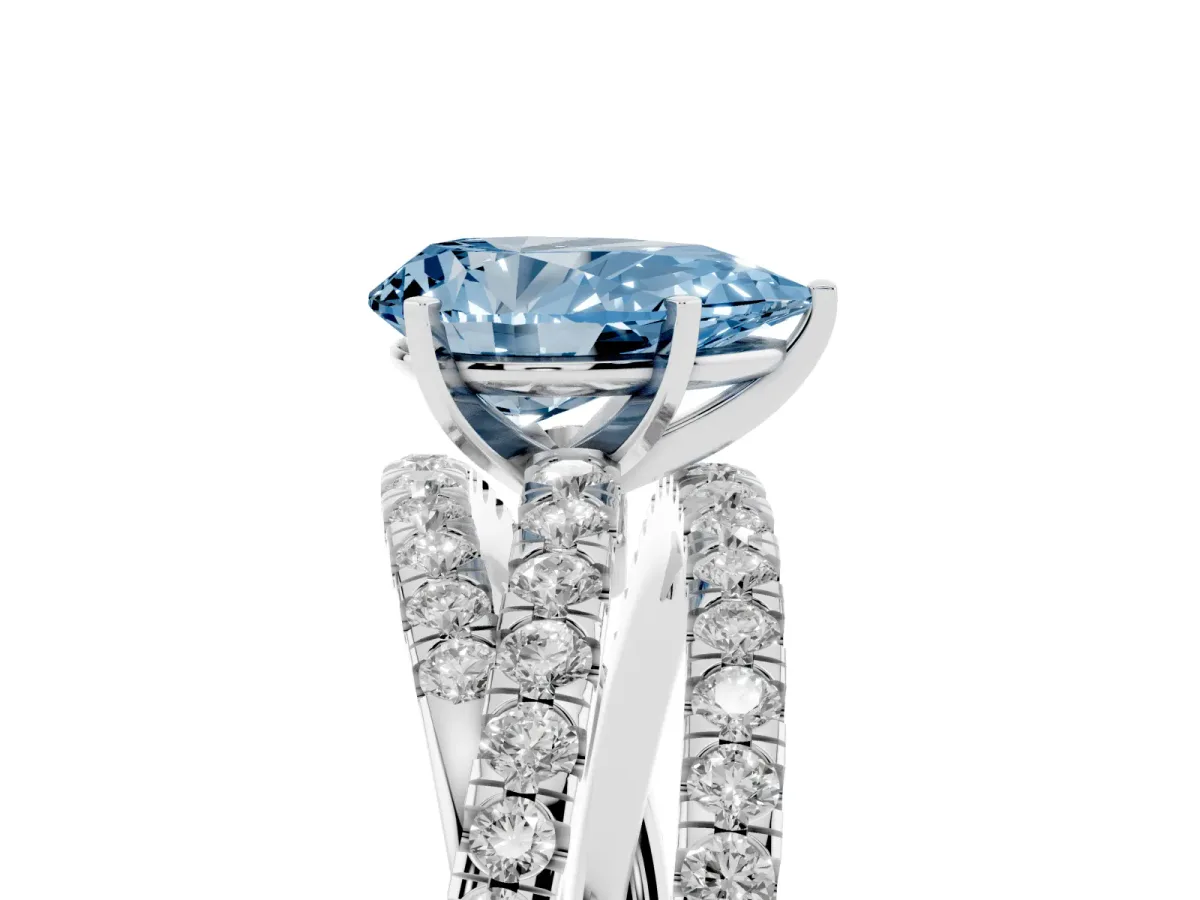 Fancy Blue Pear Cut Solitaire Twist Band with Pavé Setting and Four-Prong Setting Silver