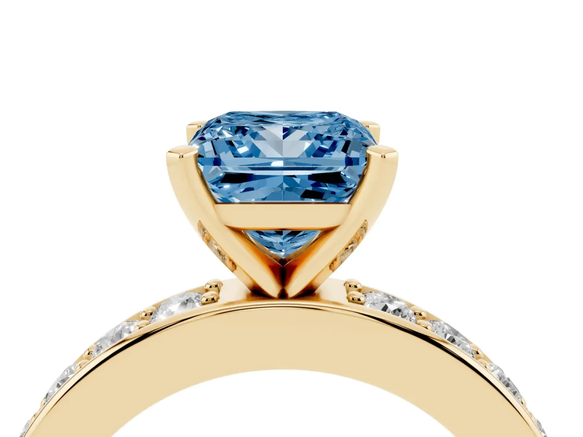 Fancy Blue Princess Cut Diamond Engagement Ring with Channel Set Round Band and Prong Setting Yellow gold