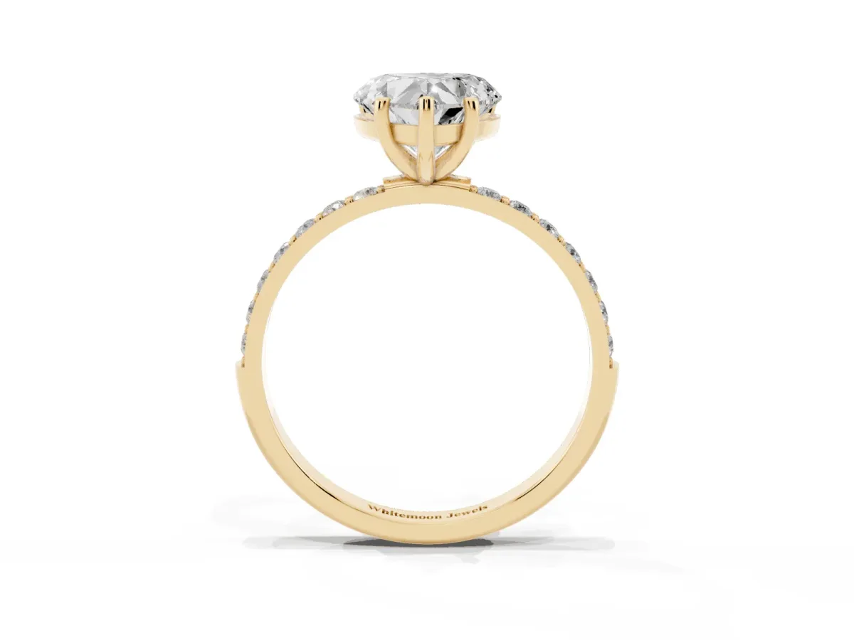 Heart Cut Diamond Solitaire Ring with Round Pavé Shoulders and Prong Setting Yellow gold