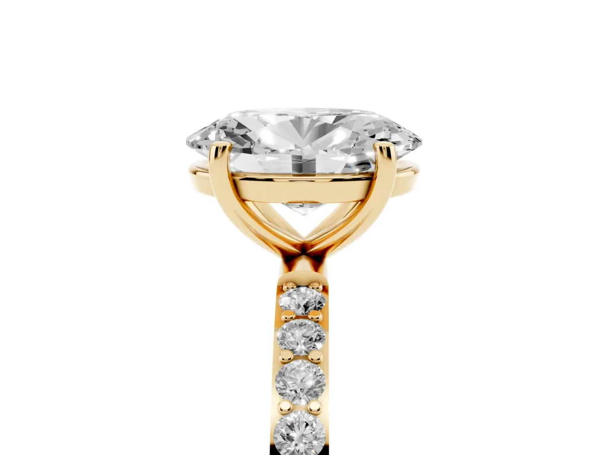 Oval Cut Diamond Solitaire Ring with Round Pavé Shoulders and Prong Setting Yellow gold