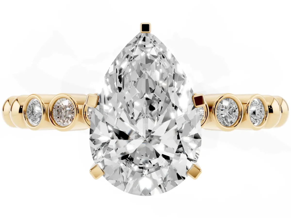 Pear Cut Solitaire Bezel Accent Diamond Engagement Ring with Beaded Band and Four-Prong Setting Yellow gold