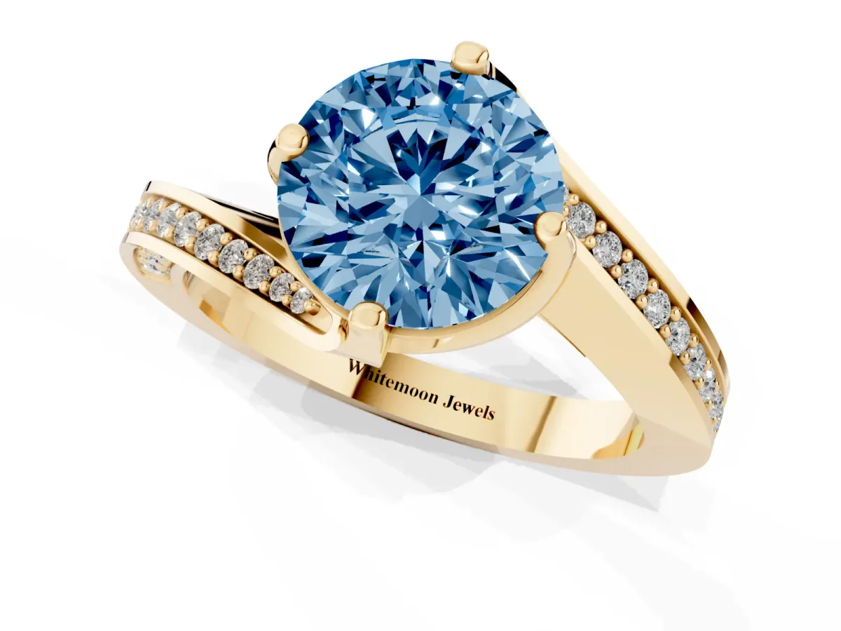 Fancy Blue Round Cut Solitaire Diamond Twist Band with Pavé Setting and Four-Prong Setting Yellow gold