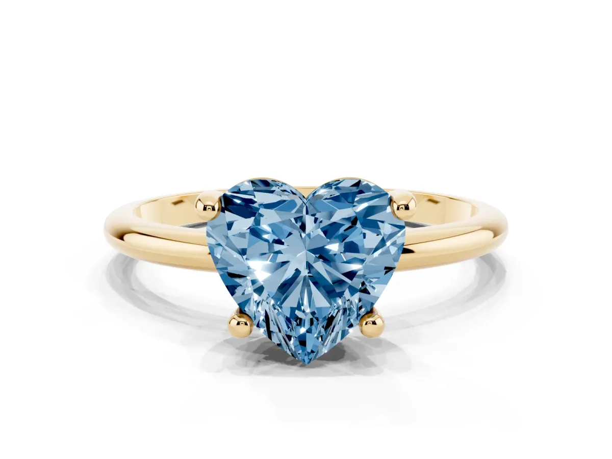 Fancy Blue Heart Cut Solitaire Diamond Ring with 4-Prong Setting on a Classic Band Yellow gold