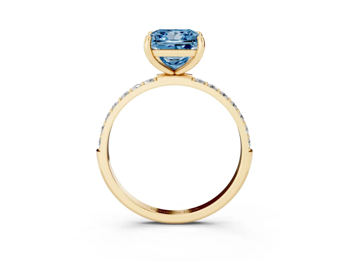 Fancy Blue Princess Cut Diamond Solitaire Ring with Round Pavé Band and Prong Setting Yellow gold