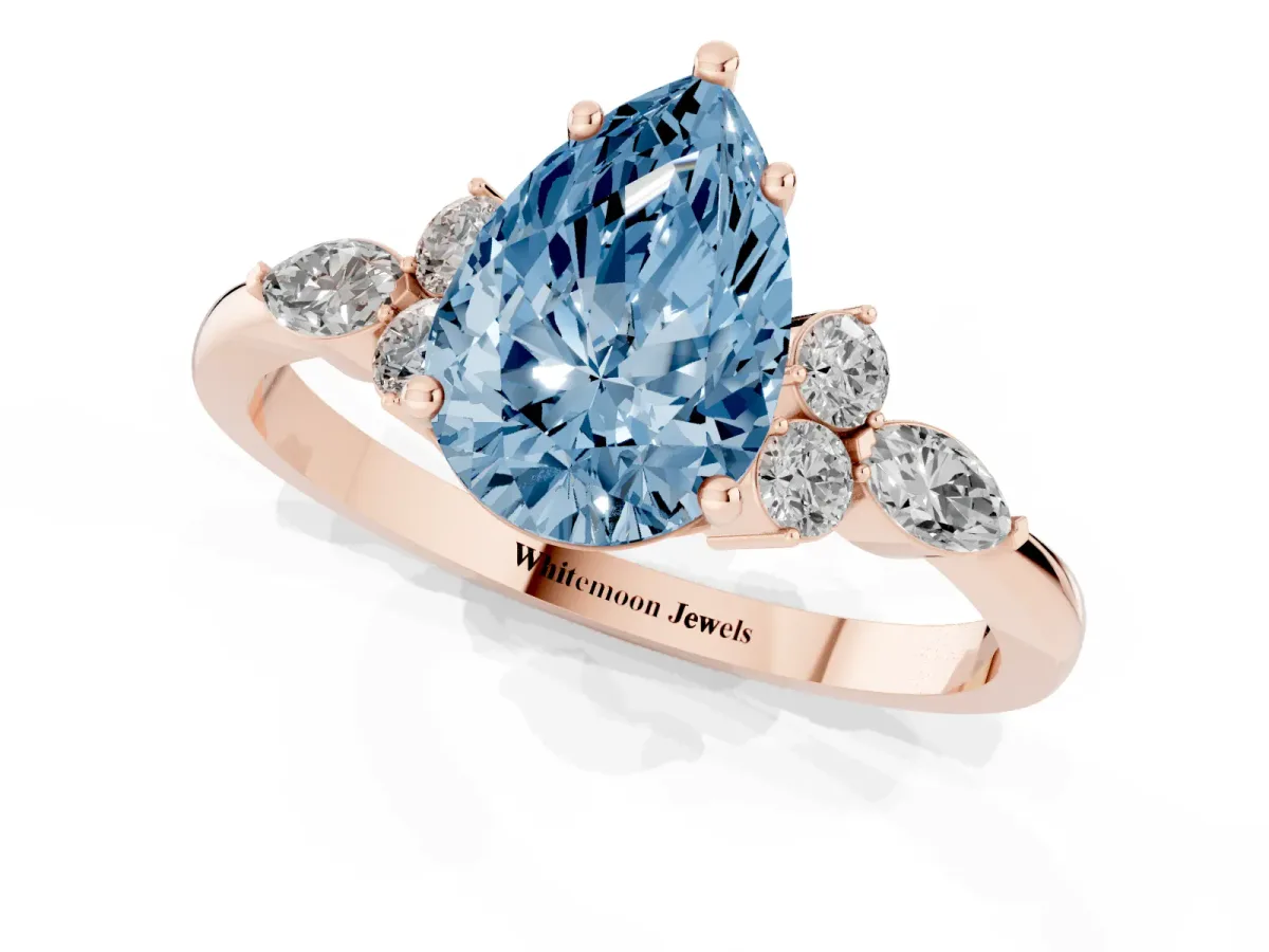 Fancy Blue Pear Cut Brilliant Diamond Solitaire Ring with Pear Side Stones and Four-Prong Setting Rose gold