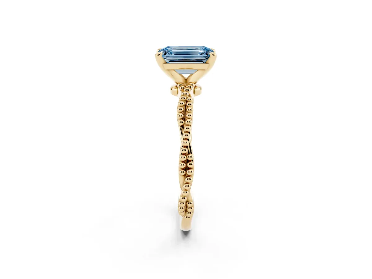 Fancy Blue Emerald Cut Solitaire Twisted Band with Bead Prong Setting Yellow gold