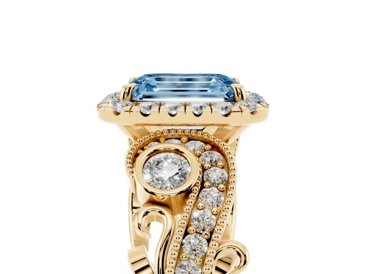 Fancy Blue Emerald Cut Halo Diamond Ring with Milgrain and Bezel Accents on a Split Shank Band Yellow gold