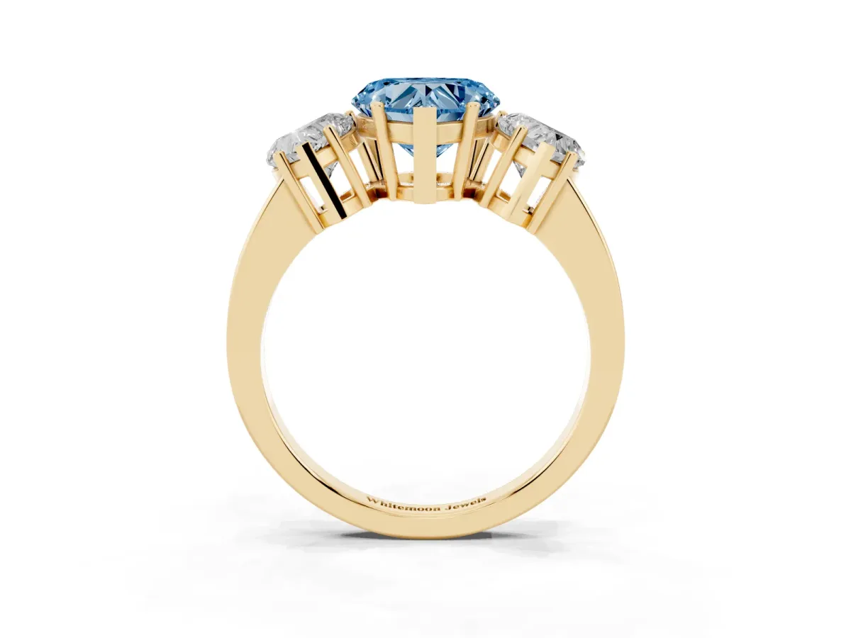 Fancy Blue Three-Stone Heart Cut Cut Diamond Engagement Ring with Flat Band and Four-Prong Setting Yellow gold
