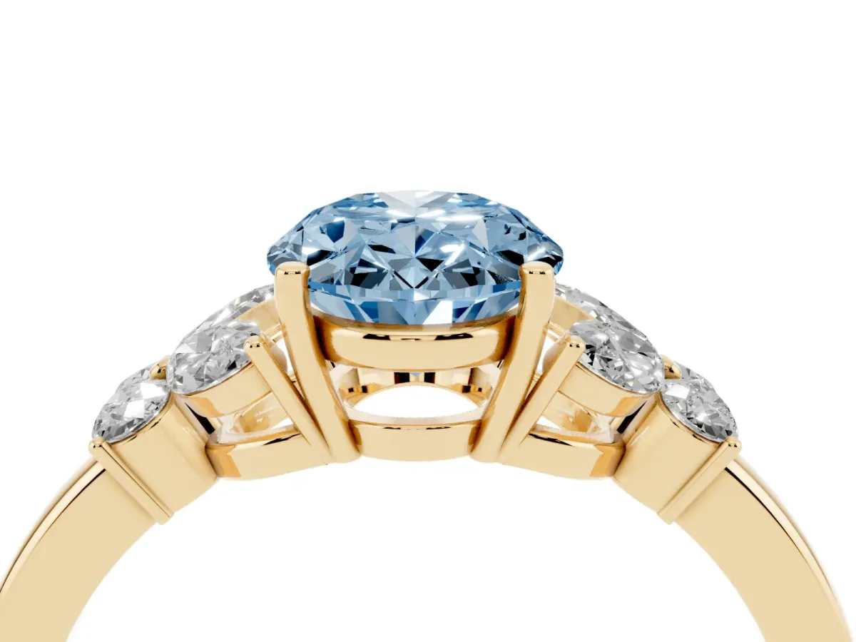 Fancy Blue Oval Cut Cut Solitaire Floral Diamond Ring with Four-Prong Setting Yellow gold