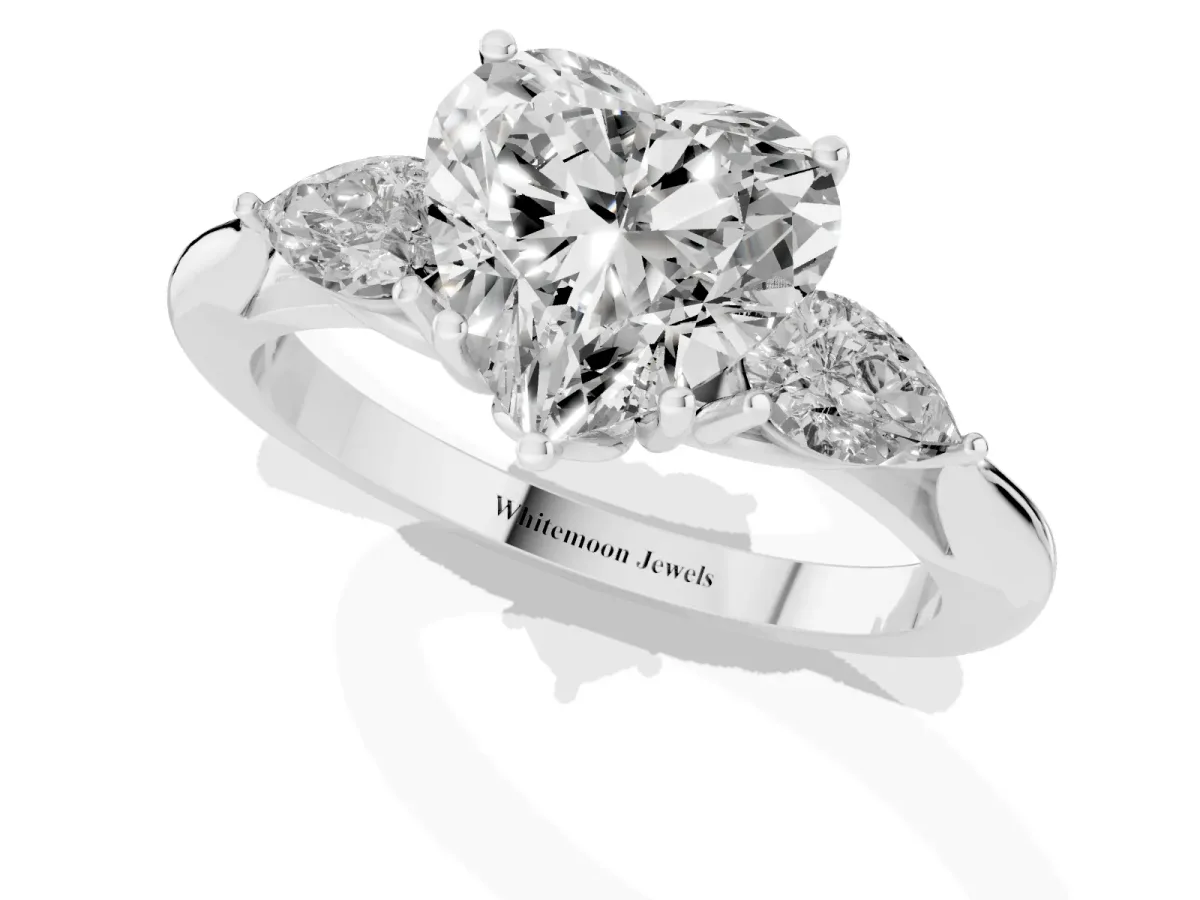 Heart Cut Diamond Three-Stone Ring with Pear Side Stones and Prong Setting Platinum