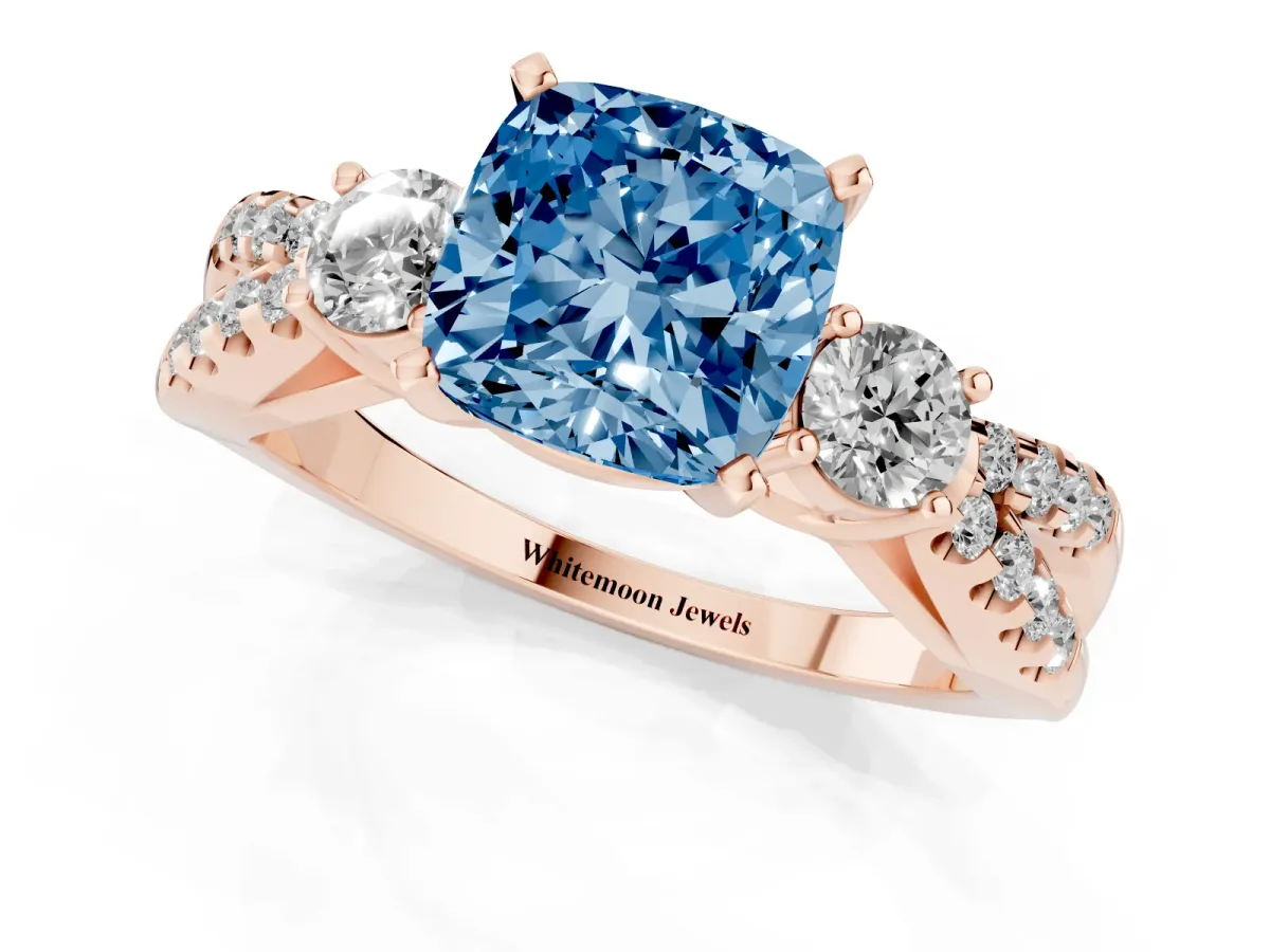 Fancy Blue Cushion Cut Diamond Three-Stone Ring with Pavé Split Shank and Four-Prong Setting Rose gold