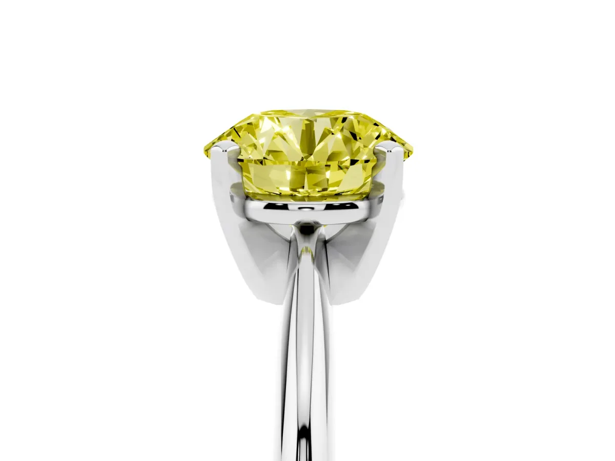 Fancy Yellow Round Cut Cut Solitaire Ring with Four-Prong Setting on a Classic Band Silver