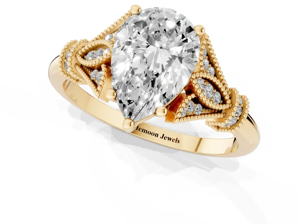 Pear Cut Diamond Solitaire Ring with Floral Filigree and Pave Accents Yellow gold