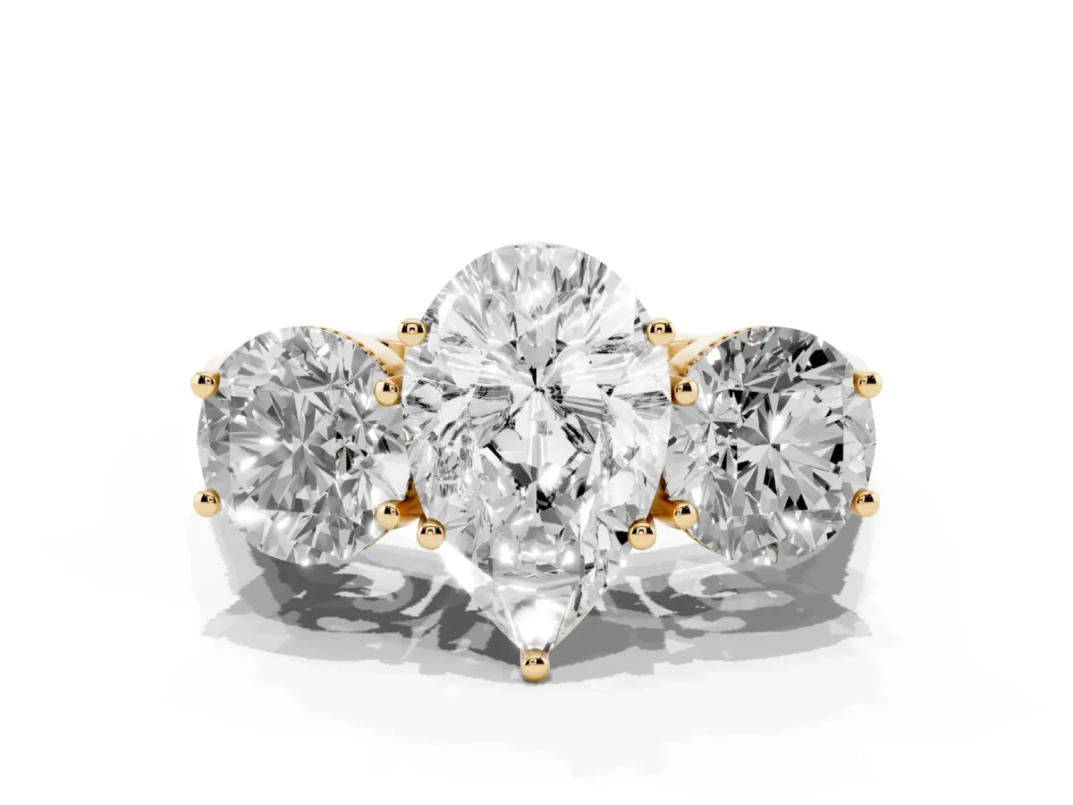 Three-Stone Pear Cut Diamond Engagement Ring with Prong Setting on a Classic Band Yellow gold