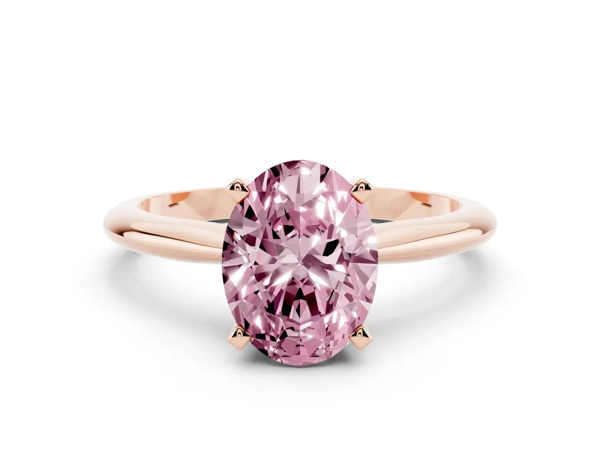 Fancy Pink Oval Cut Cut Solitaire Ring with Four-Prong Setting on a Classic Band Rose gold