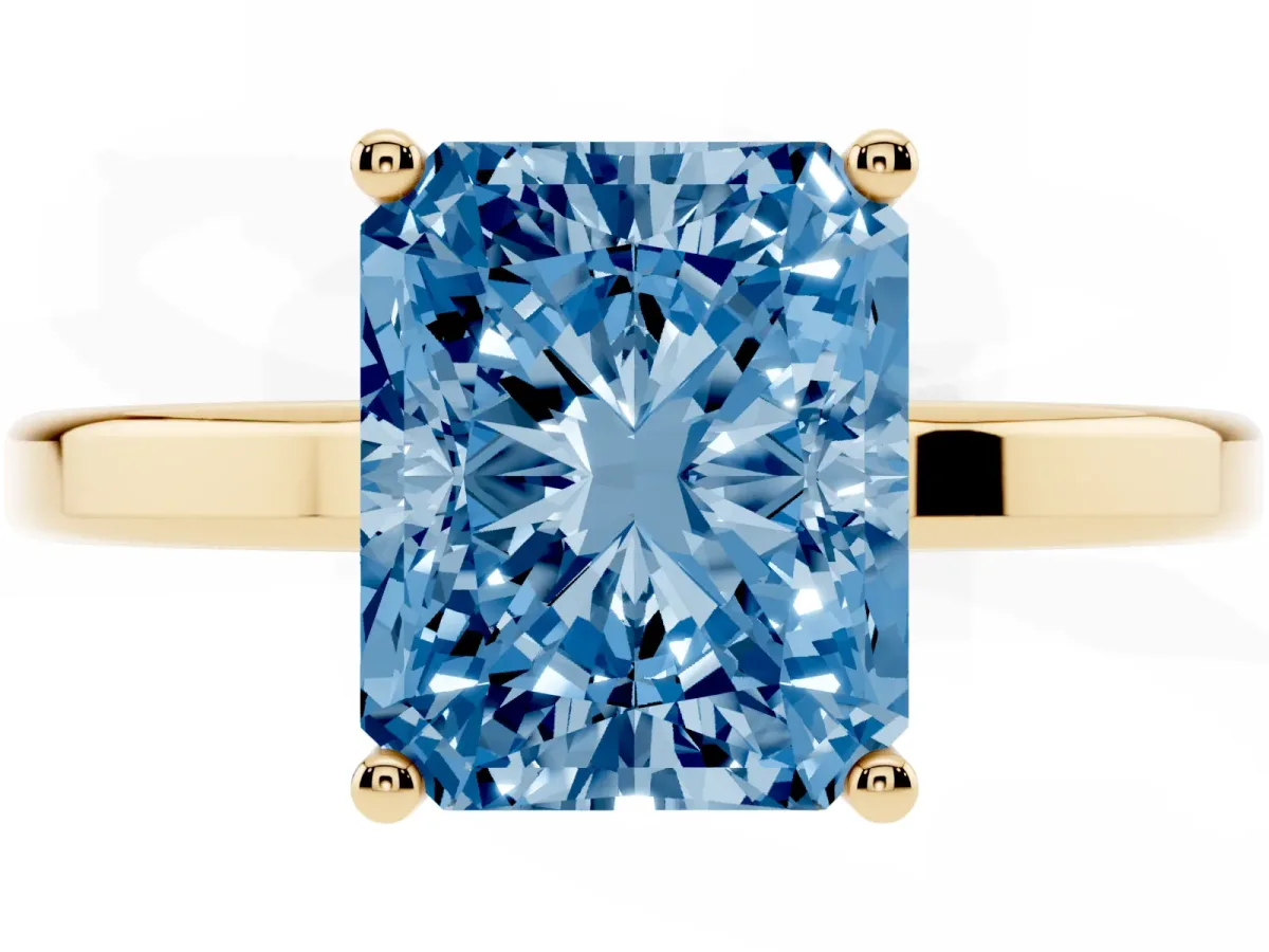 Fancy Blue Radiant Cut Cut Solitaire Engagement Ring with Four-Prong Setting on a Classic Band Yellow gold