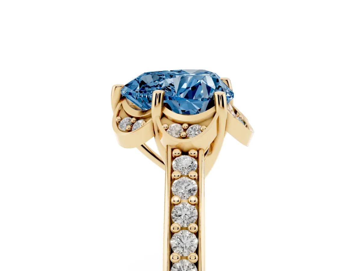 Fancy Blue Heart Cut Cut Halo Diamond Ring with Channel Set Band and Four-Prong Setting Yellow gold