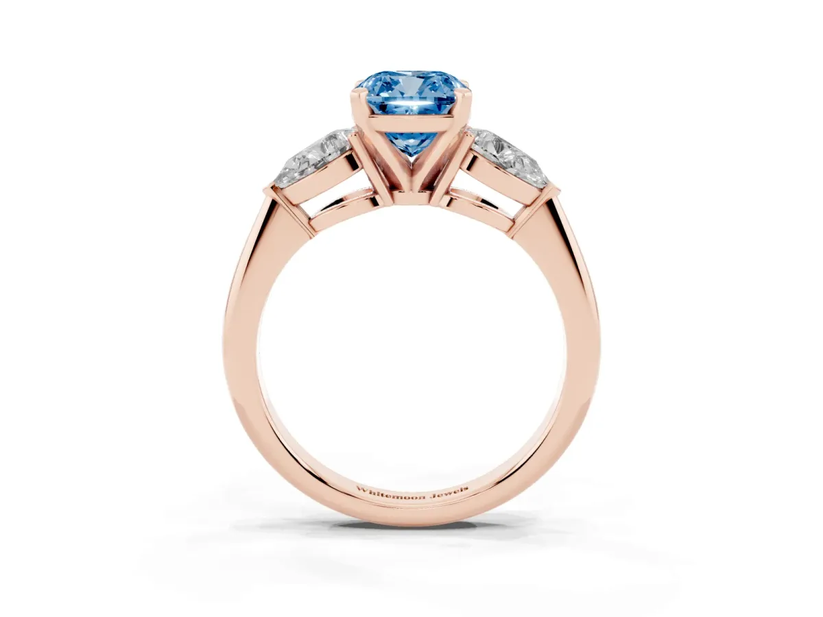 Fancy Blue Three-Stone Cushion Cut Diamond Ring with Pear Side Stones and Four-Prong Setting Rose gold