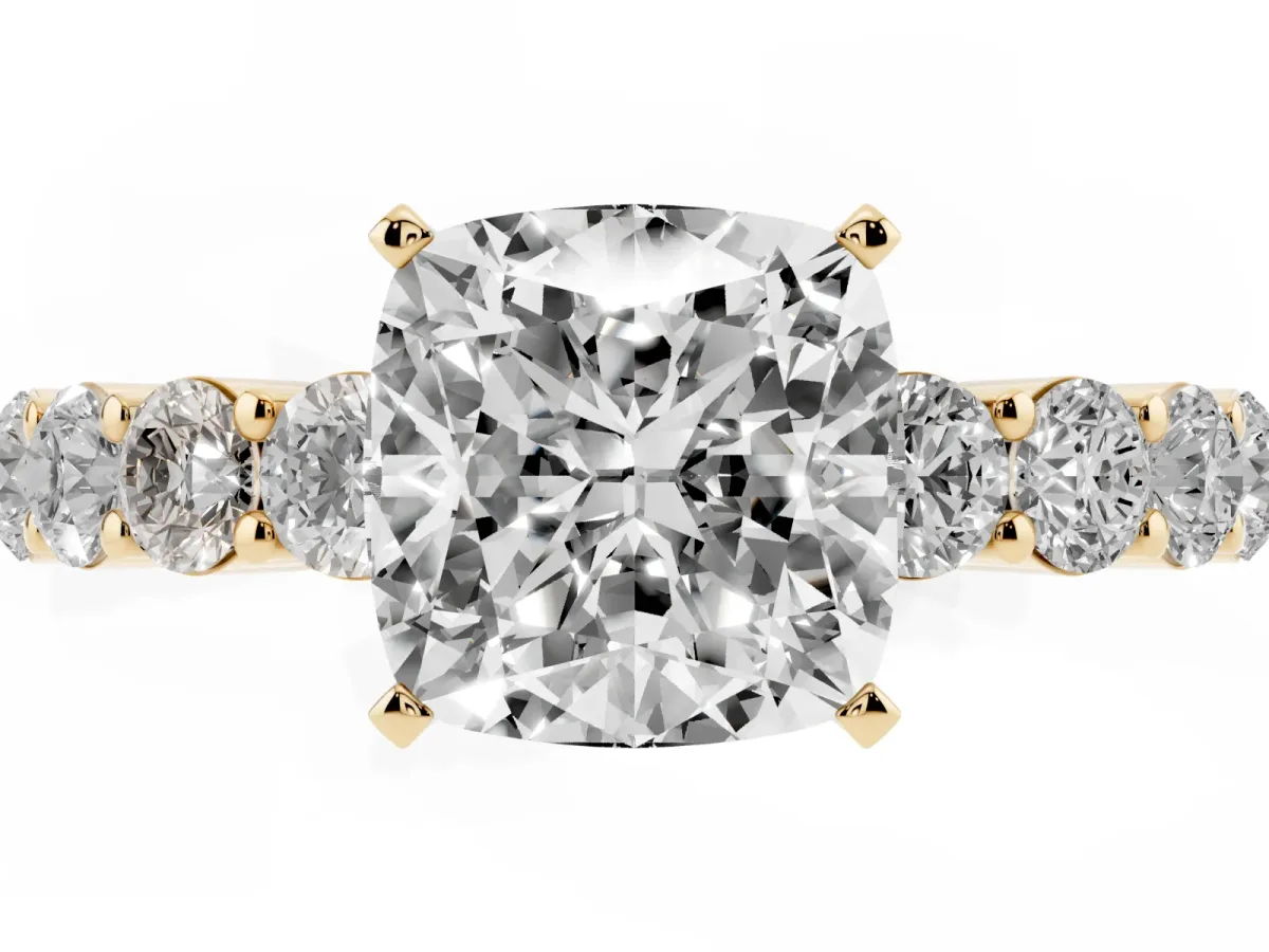 Cushion Cut Diamond Solitaire Ring with Shared Prong Round Side Stones Yellow gold