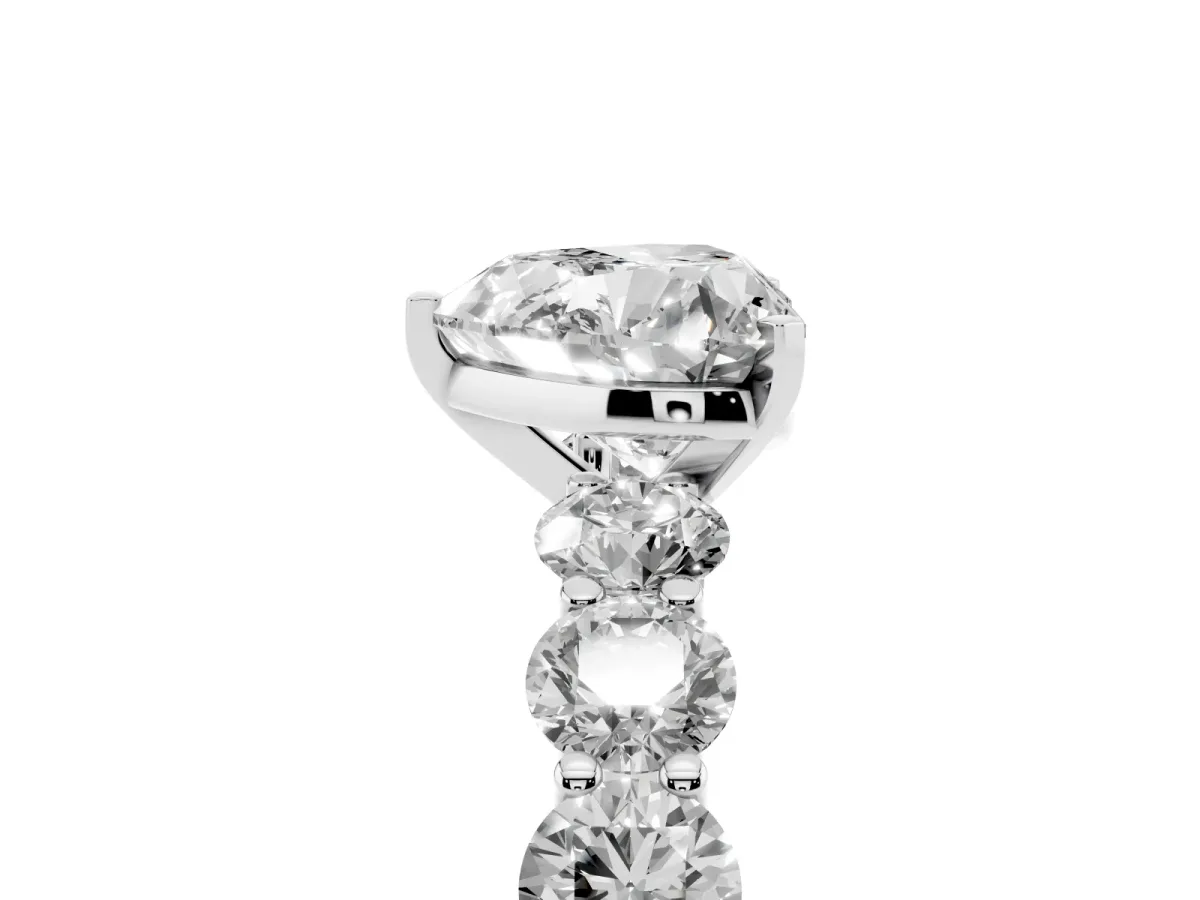 Heart Cut Diamond Prong Setting with Side Stones on a Pave Band Silver