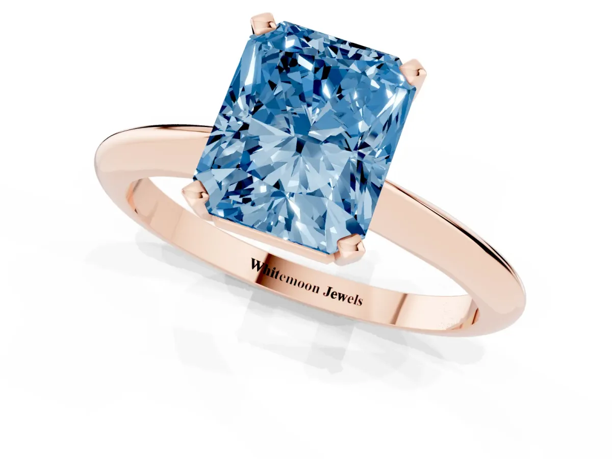 Fancy Blue Radiant Cut Cut Solitaire Ring with Four-Prong Setting on a Classic Band Rose gold