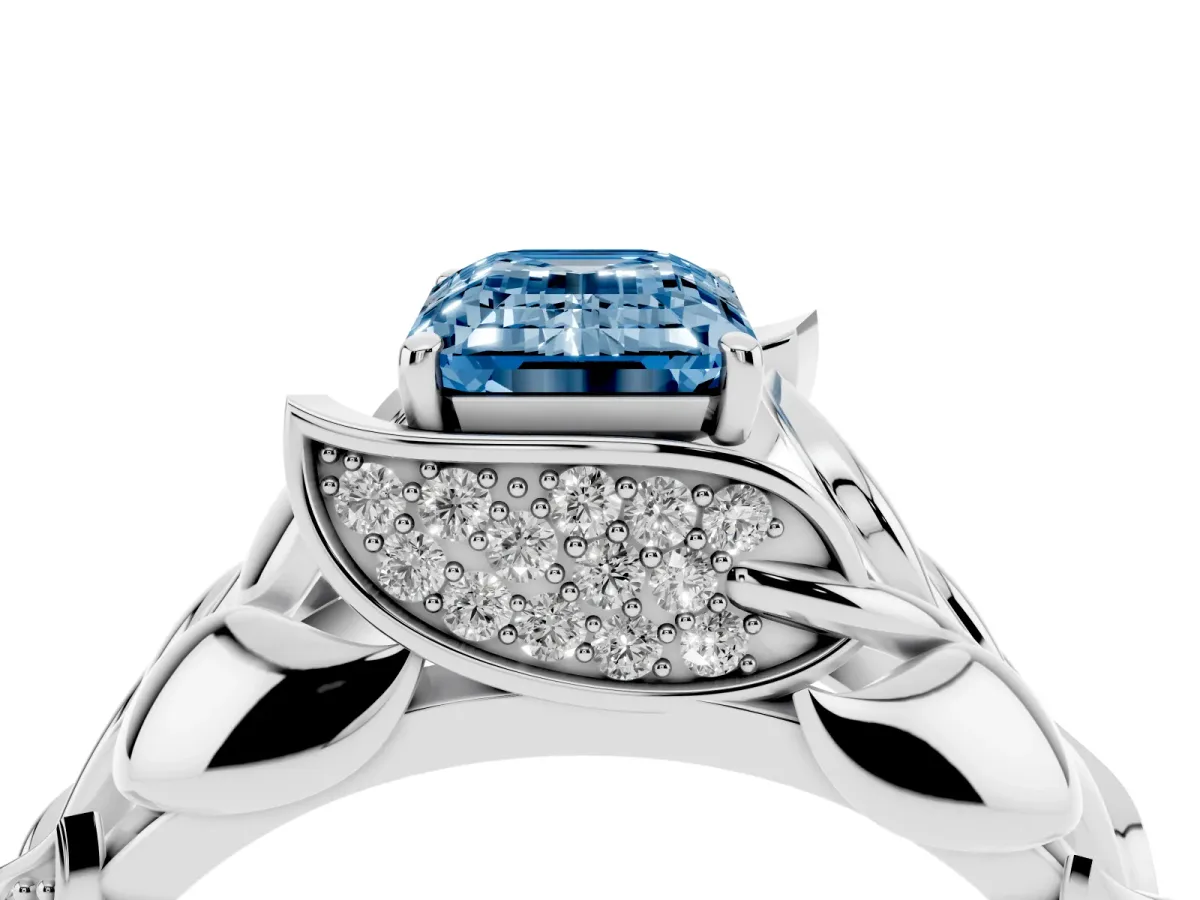 Fancy Blue Emerald Cut Diamond Leaf-Inspired Engagement Ring with Round Accents and Prong Setting Silver
