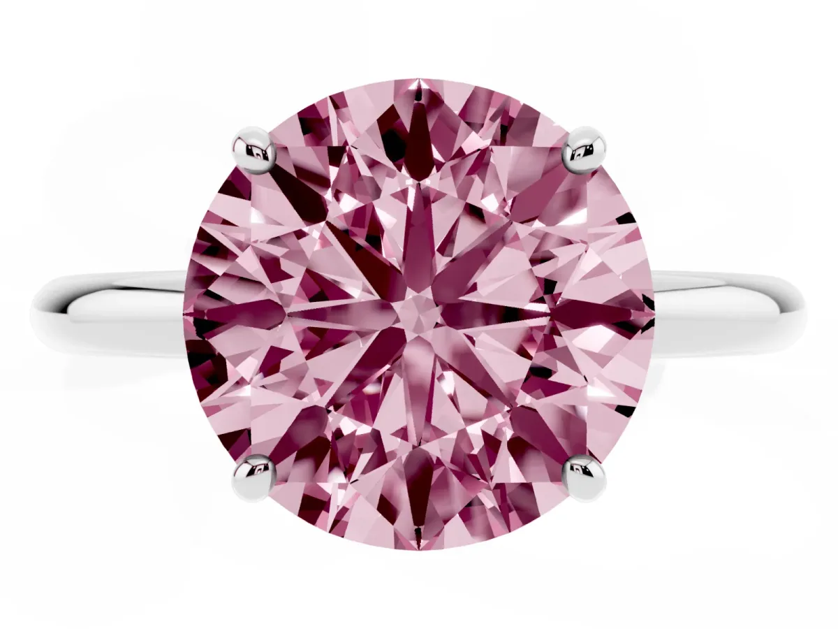 Fancy Pink Round Cut Solitaire Diamond Ring with Four-Prong Setting on a Plain Band Platinum