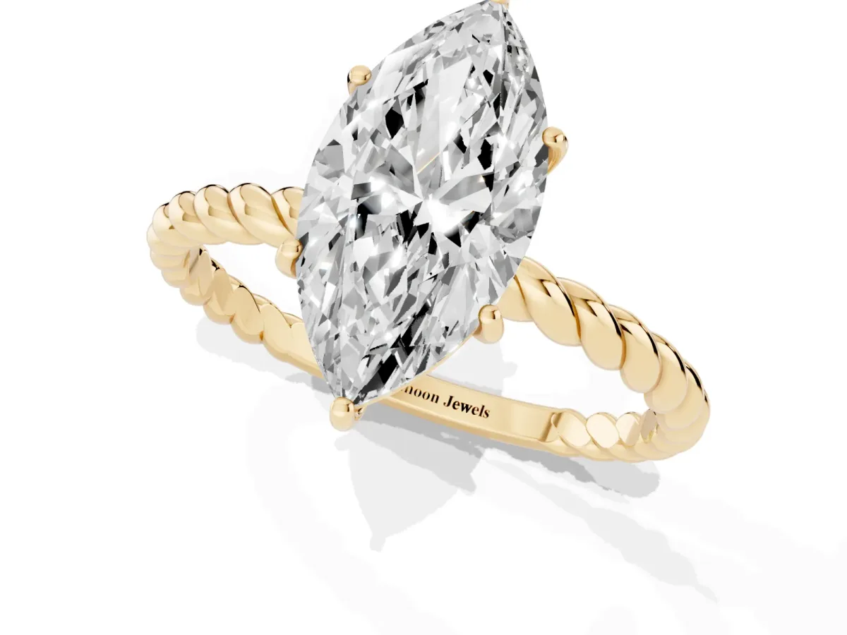 Marquise Cut Solitaire Twist Band Ring with Four-Prong Setting Yellow gold