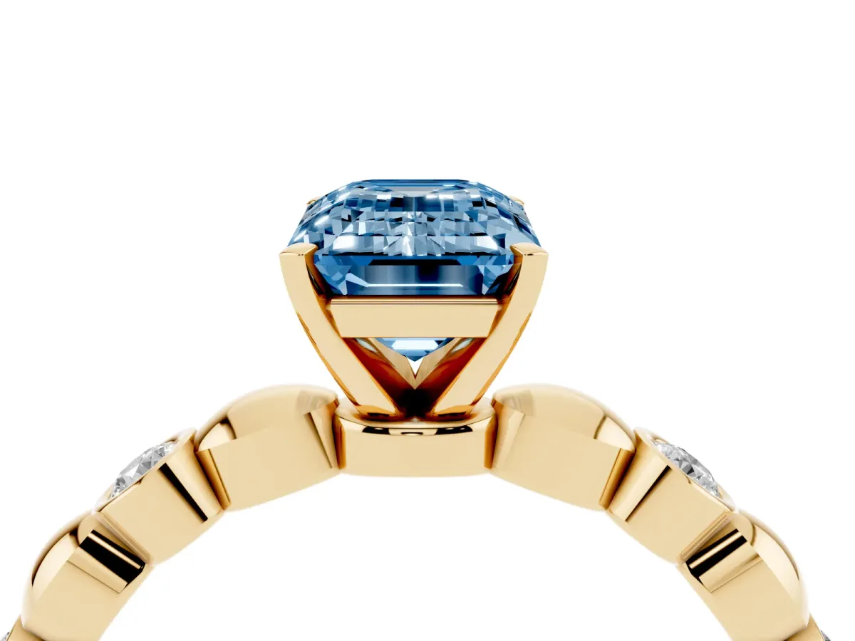 Fancy Blue Emerald Cut Solitaire Bezel-Set Diamond Ring with Beaded Band and Four-Prong Setting Yellow gold
