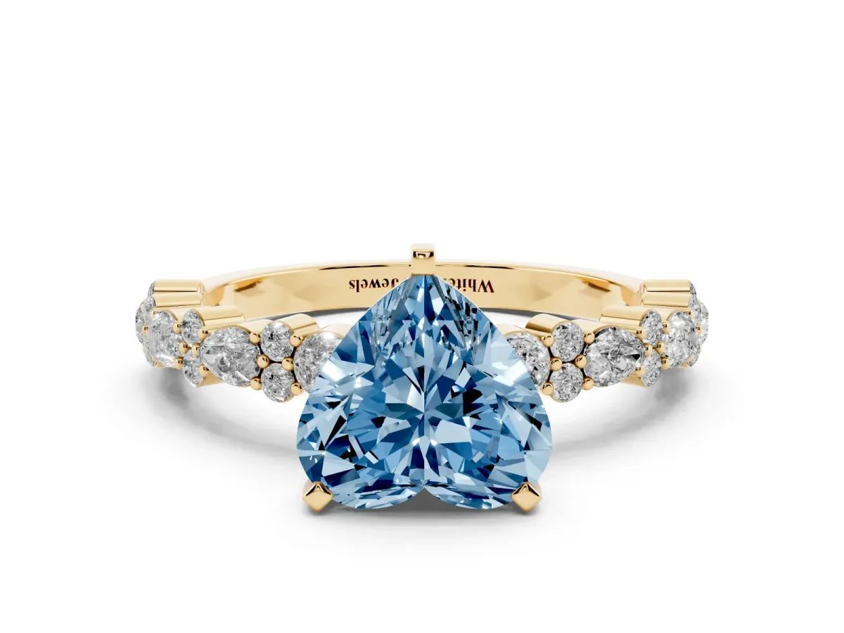 Fancy Blue Heart Cut Diamond Side Stone Solitaire Ring with Round and Four-Prong Setting Yellow gold