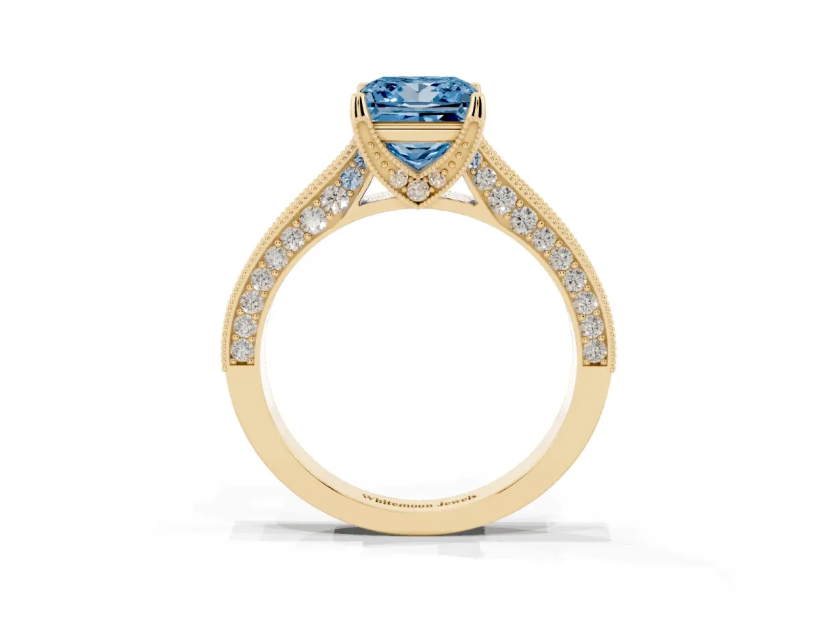 Fancy Blue Princess Cut Cut Diamond Solitaire Ring with Milgrain Pave Band and Four Prong Setting Yellow gold