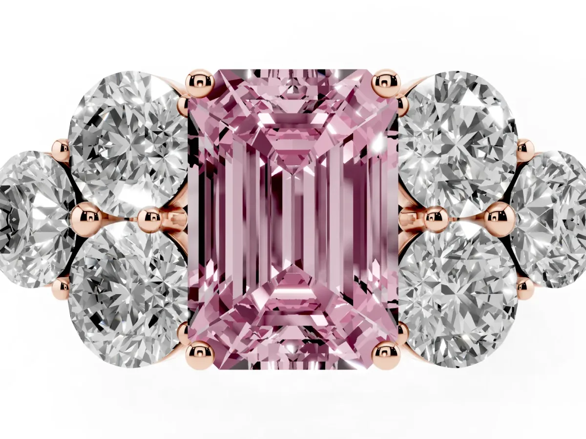 Fancy Pink Emerald Cut Cut Diamond Cluster Ring with Round Accent Stones and Prong Setting on a Classic Band Rose gold