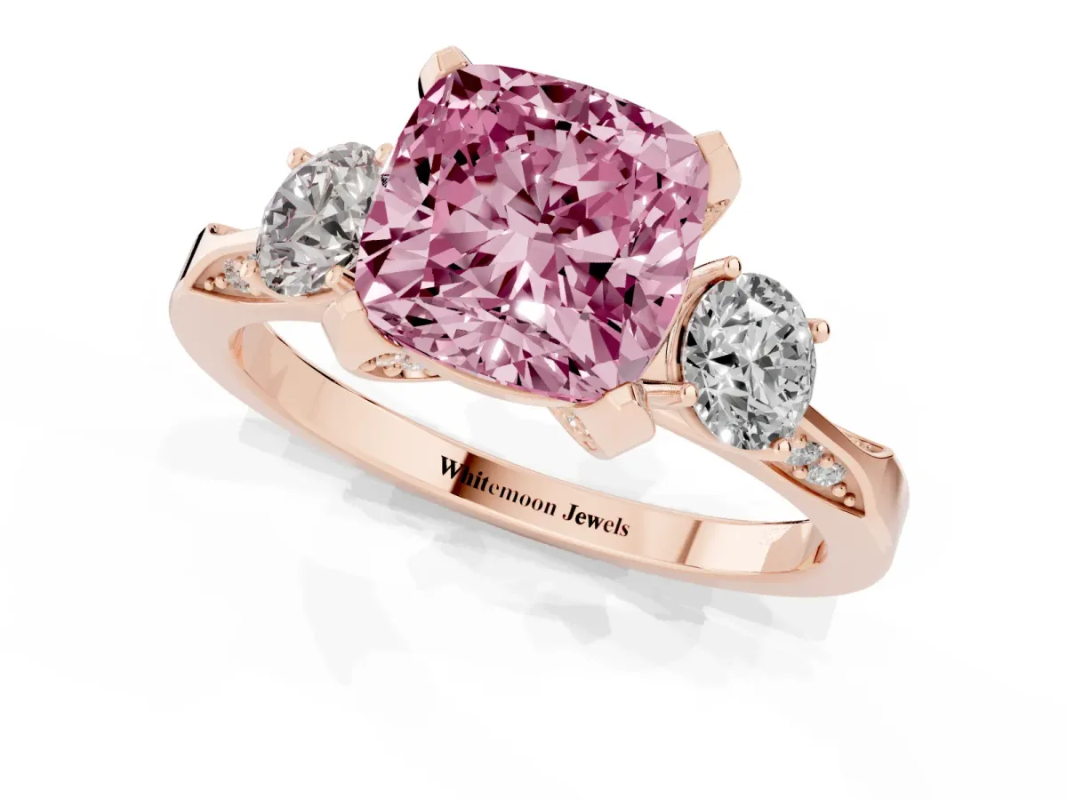 Fancy Pink Cushion Cut Brilliant Three-Stone Diamond Ring with Pavé Band and Four-Prong Setting Rose gold