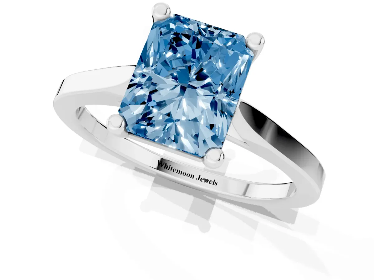Fancy Blue Radiant Cut Solitaire Diamond Ring with Four-Prong Setting and Tapered Band Silver