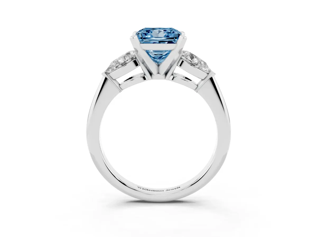 Fancy Blue Three-Stone Princess Cut Diamond Ring with Pear Side Stones and Four-Prong Setting Platinum