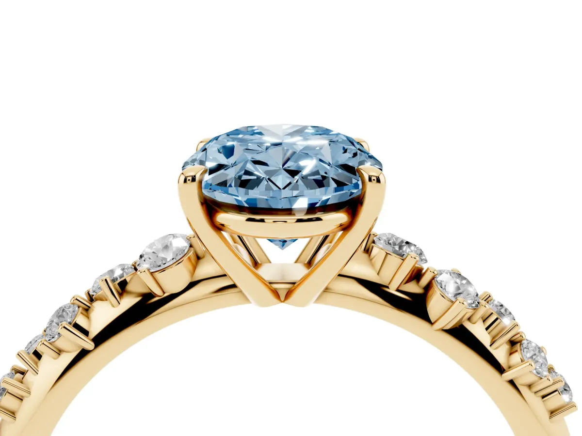 Fancy Blue Oval Cut Diamond Cluster Side Stone Solitaire Ring with Prong Setting Yellow gold