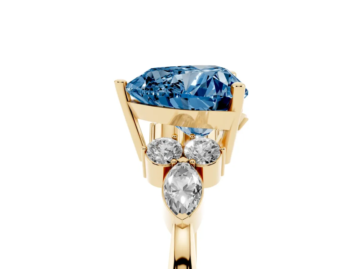 Fancy Blue Heart Cut Brilliant Diamond Solitaire Ring with Pear Side Stones and Four-Prong Setting Yellow gold
