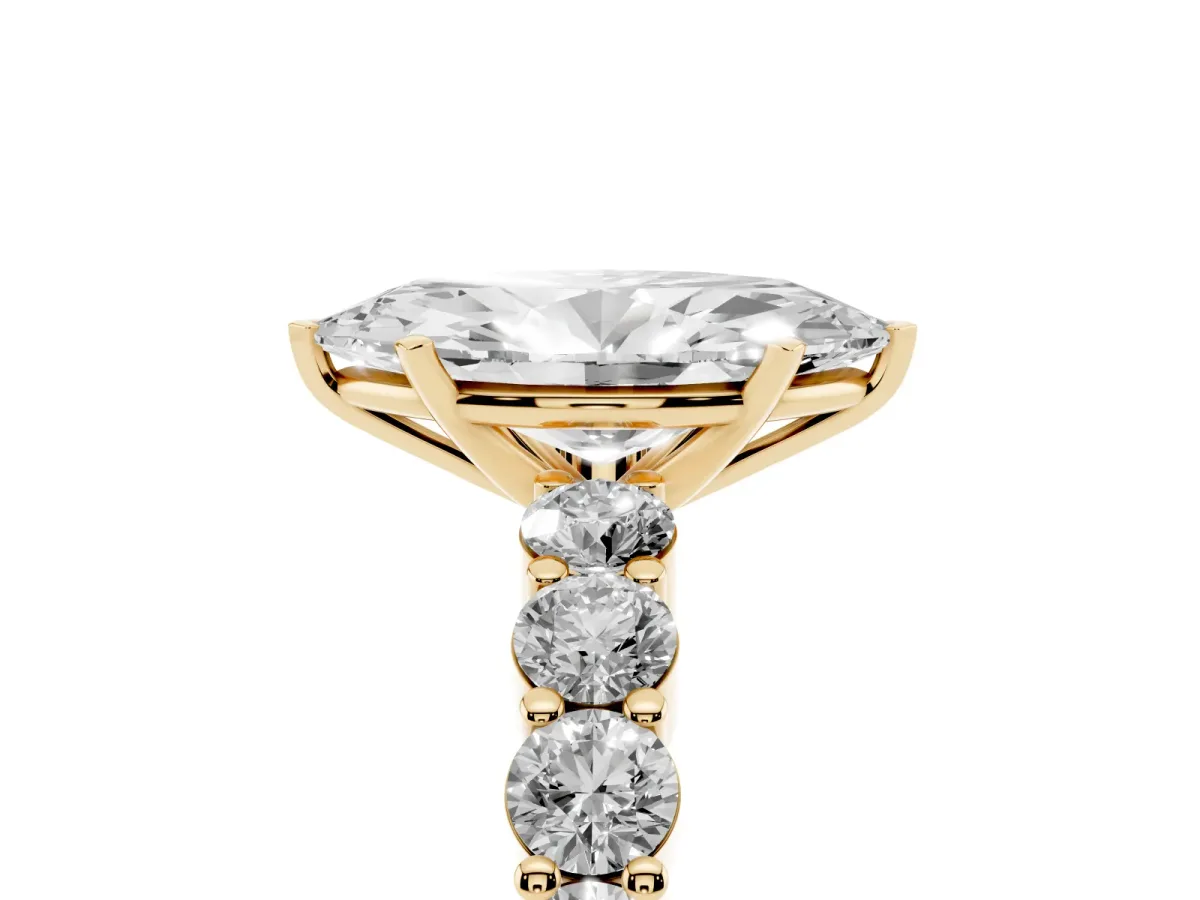 Marquise Cut Diamond Solitaire Ring with Shared Prong Round Side Stones Yellow gold