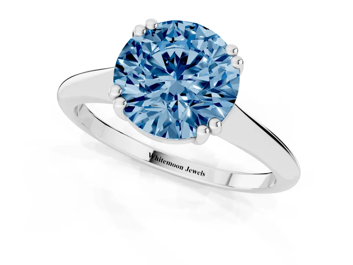 Fancy Blue Round Cut Solitaire Diamond Ring with Six-Prong Setting and Classic Band Silver