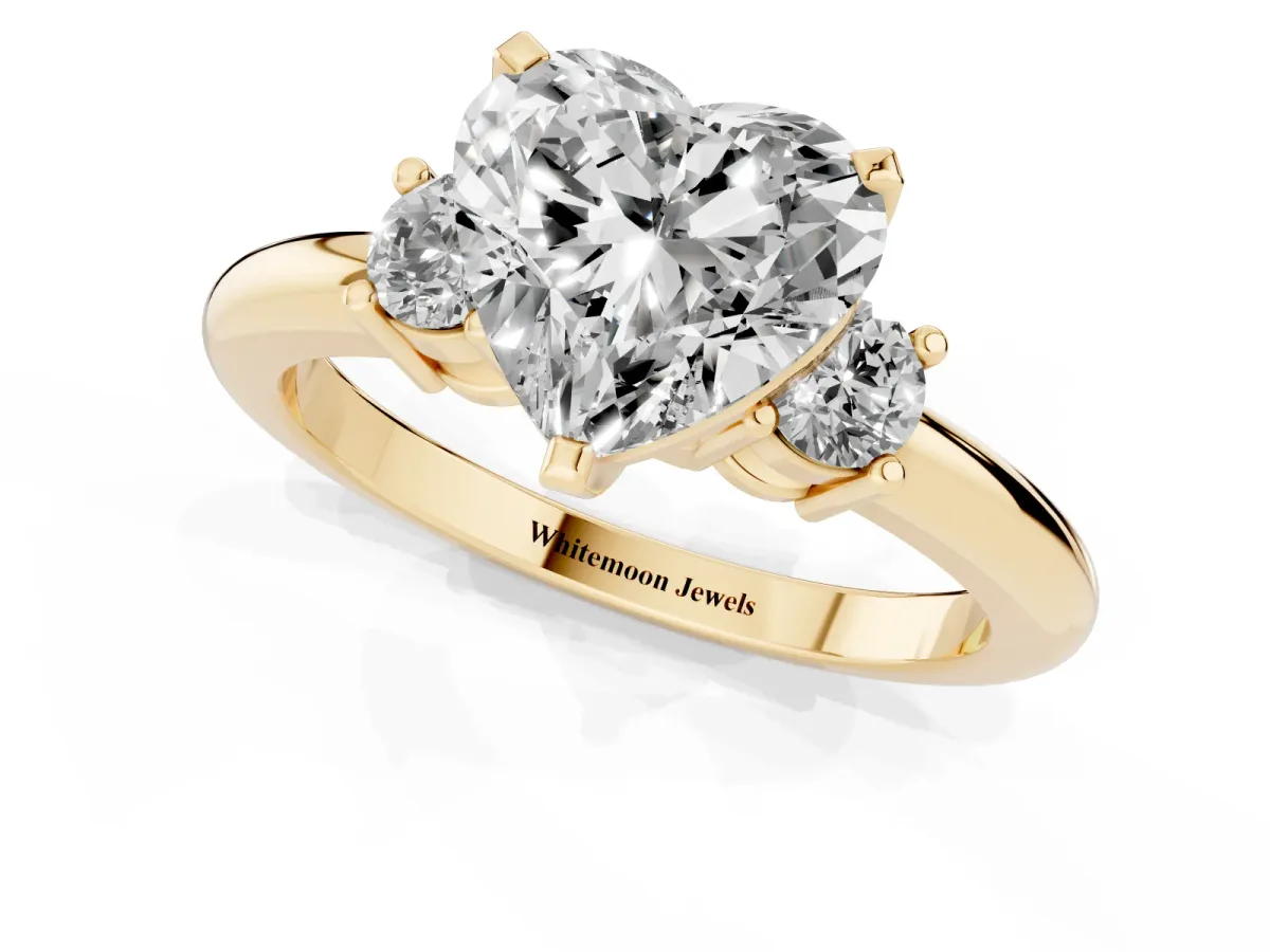 Three-Stone Heart Cut Cut Diamond Solitaire with Prong Setting and Classic Band Yellow gold