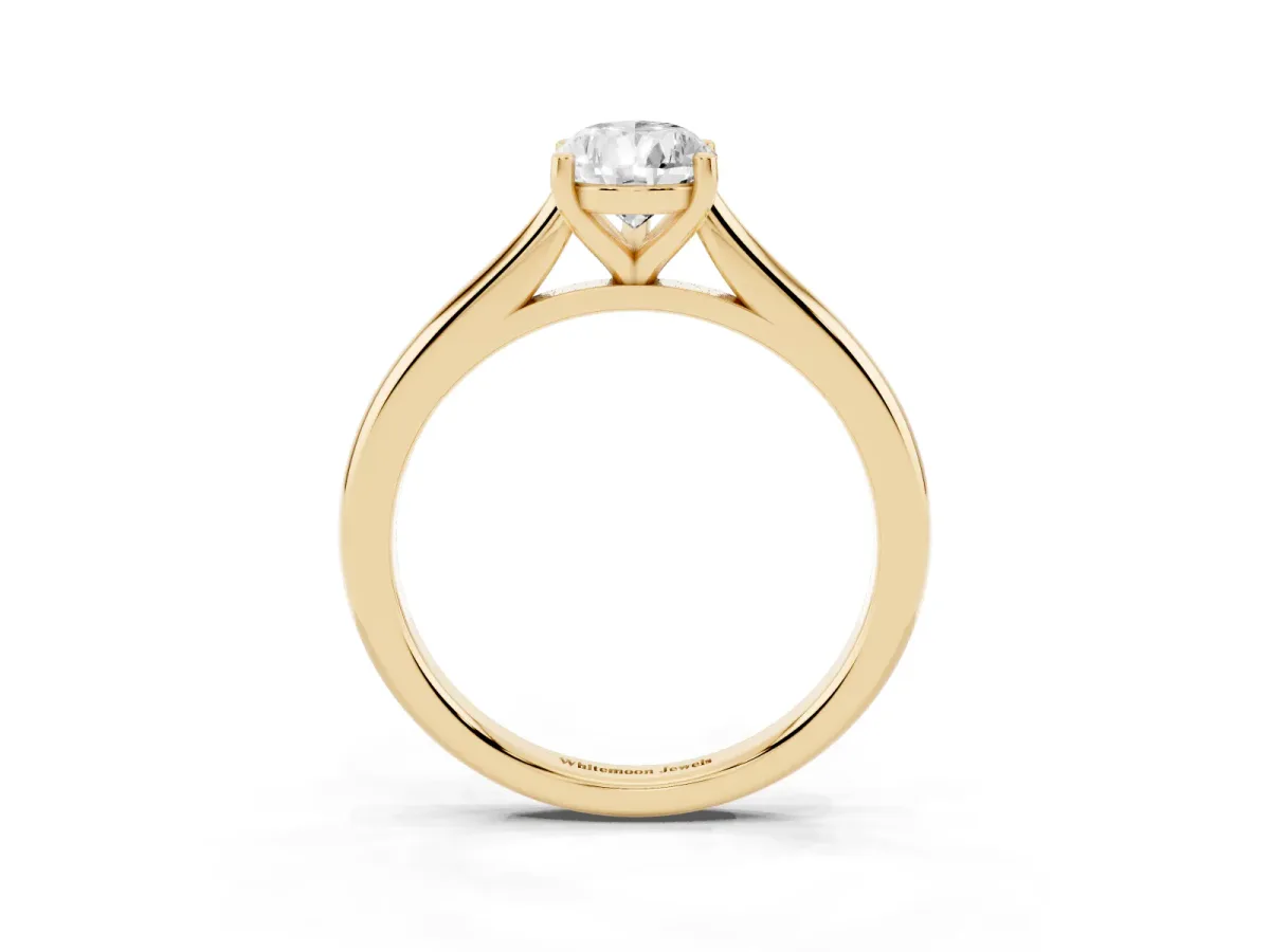 Pear Cut Cut Solitaire Ring with Cathedral Band and Four-Prong Setting Yellow gold