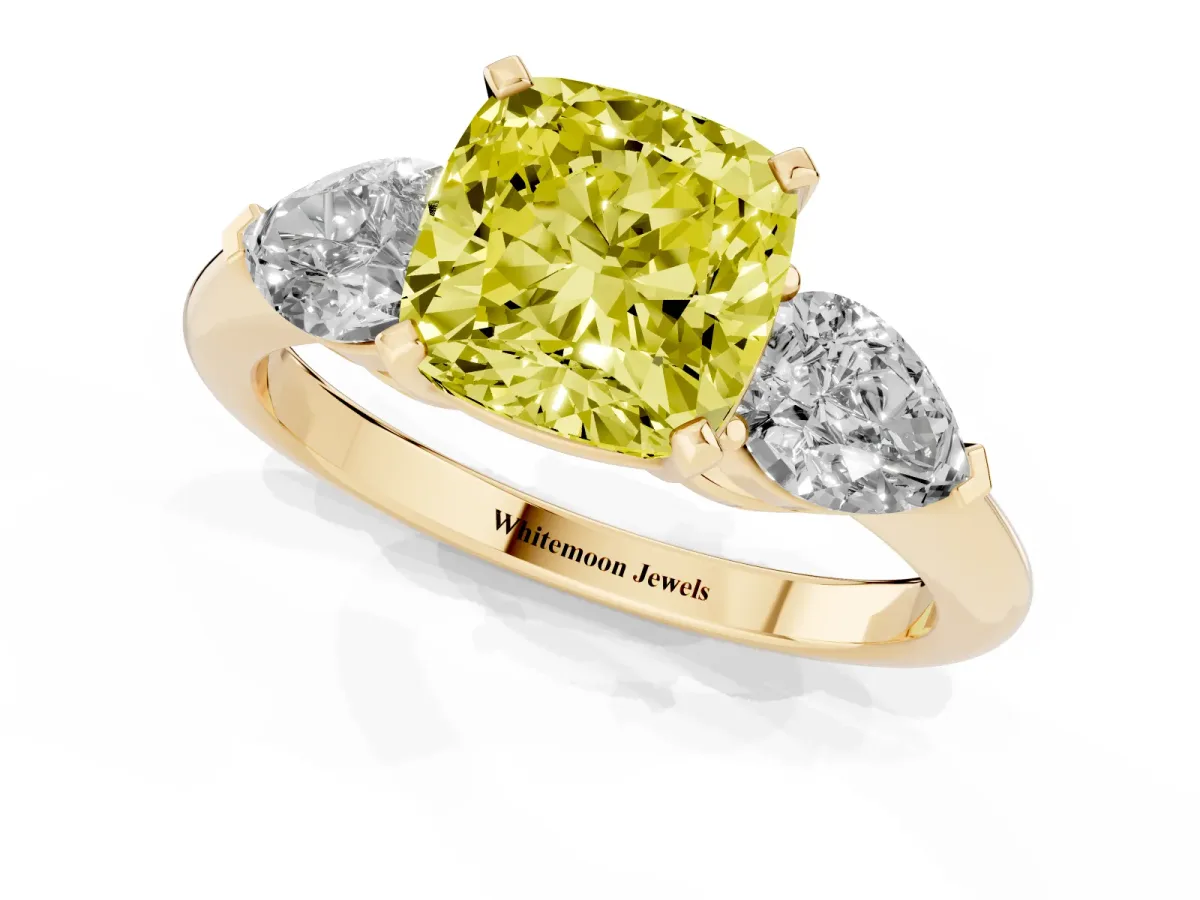 Fancy Yellow Three-Stone Cushion Cut Diamond Ring with Pear Side Stones and Four-Prong Setting Yellow gold